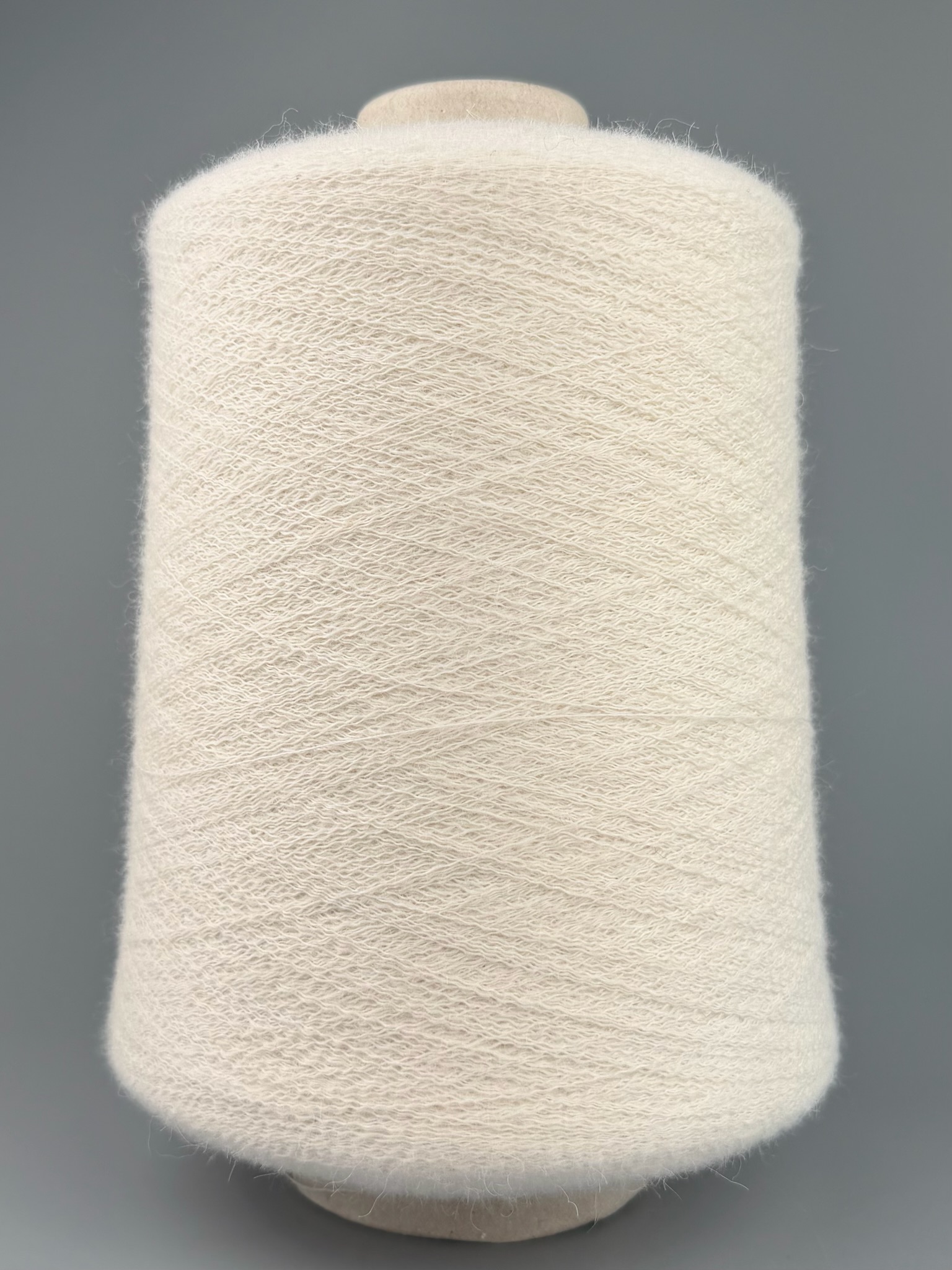 Pecci Filati Art. FLUIDO 2000 m / 100 g – Alpaka Merino Garn mit Polyamid col. Naturweiss foto 2